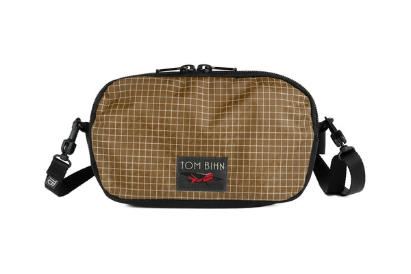The Bantam in Coyote 200 Halcyon with a shoulder strap